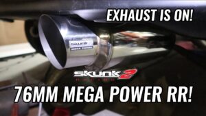 Putting the new exhaust on the hatch!